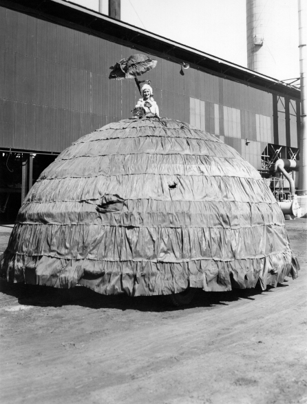 Reata Armstrong as Dolly Varden on Works Manager's car, VP Day Procession (Frank Whitworth collection)